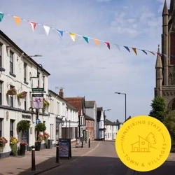 A banner promoting towns and village stays at Greene King Inns. 