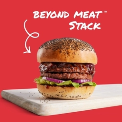 A banner promoting the Beyond Meat Stack burger at Hungry Horse venues, showing the burger served on a wooden board.