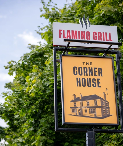 The sign outside of the Corner House.