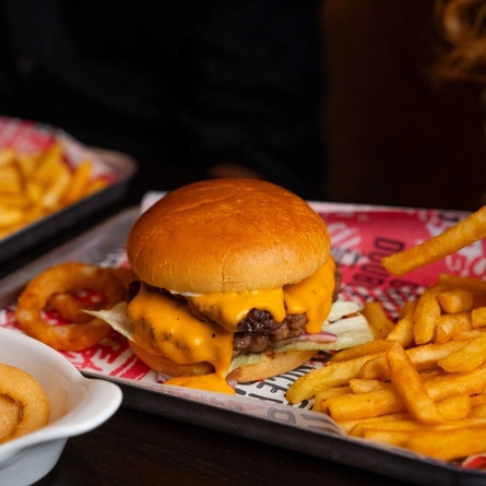 A close up of a burger from the new Spring/Summer menu at Flaming Grill.