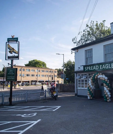 The exterior facade and car park at The Spread Eagle.