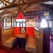 Interior dining area of a pub with a TV.