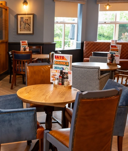The interior restaurant seating area with dartboard, at The Star in Gillingham.