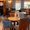 The interior restaurant seating area with dartboard, at The Star in Gillingham.