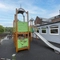 Exterior beer garden and play area of a pub.