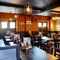 The interior restaurant seating area with TV, at The Good Intent in Hornchurch.