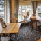 Interior dining area of a pub with a TV.