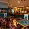 The interior bar and restaurant seating area with tables and chairs at The Church View Inn.