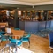 The interior bar and restaurant seating area with TV at The Hare & Hounds.