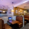 Interior dining area of a pub with a TV.