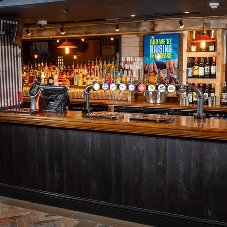 The interior bar area showing several pump clips advertising Strongbow, Strongbow Dark Fruits, San Miguel, Coors, Peroni, Madri, Birra Moretti, Carling, Stella Artois and Guinness all available at the Man of Gwent.  