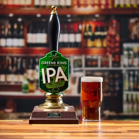 An image of an interior bar with a pint of Greene King IPA next to a Greene King IPA pump.