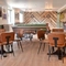 The interior restaurant seating area with TV, pool tables and dartboards at The Greengage.