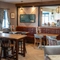 The interior restaurant and seating area with TV at the Gatehouse.