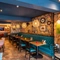 Interior dining area of a pub with a TV.