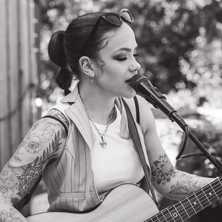 An image of Millie Claxton playing live to advertise a live music What's On event at The Cart & Horses.