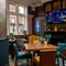 The interior restaurant and seating area with TV and fireplace at the Ship and Royal.
