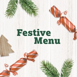 A banner showing the words "Festive Menu" surrounded by pine tree sprigs, Christmas crackers and a wooden Christmas tree shape.