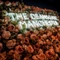 Neon sign saying Deansgate Manchester on a background of faux roses