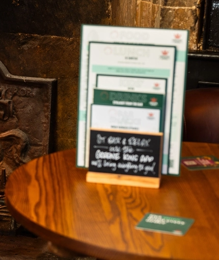 A roaring fire in a fireplace at The Red Lion, Adderbury.
