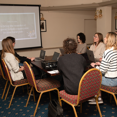 The interior Function Room being used by people at The Blue Cap.