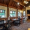 Interior dining area of a pub with a fireplace.