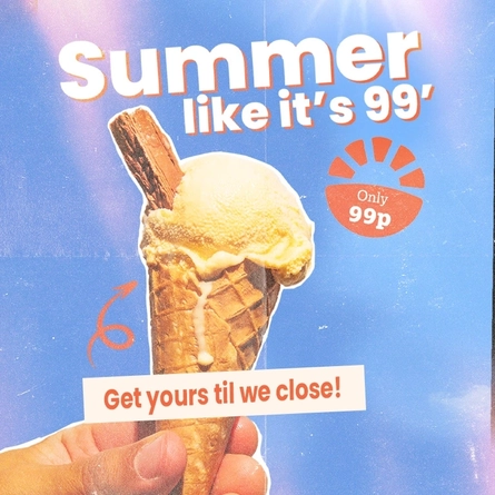 Ice cream served in a cone with a chocolate flake.
