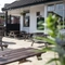 Exterior beer garden of a pub with a seating area.