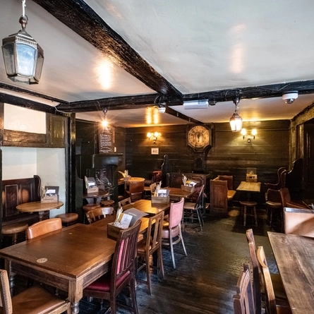 The restaurant area with fireplaces at The George in Southwark.