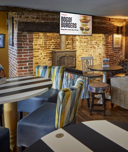 The interior restaurant and seating area with TV at the Rovers Tye.