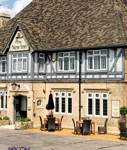 exterior facade of a pub with a seating area