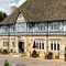 exterior facade of a pub with a seating area