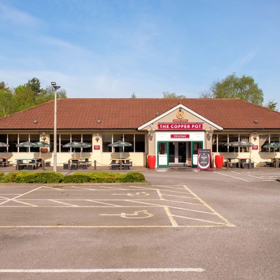 Exterior facade of a pub with a seating area.