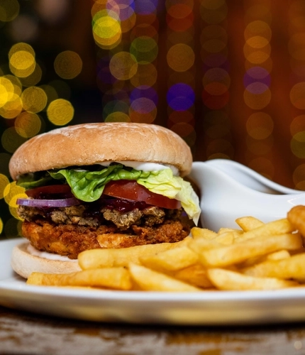 A burger and fries and a pint of beer