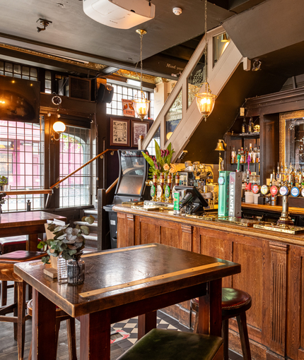 Internal bar area and seating area in a pub