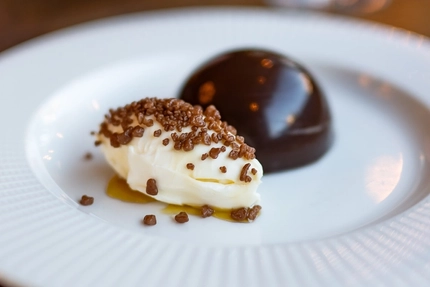 A close up advertising image of a plated Mothers Day Dessert available at Metro venues.
