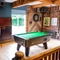 An image of the interior seating and games area with pool table and dartboard at The Guild.