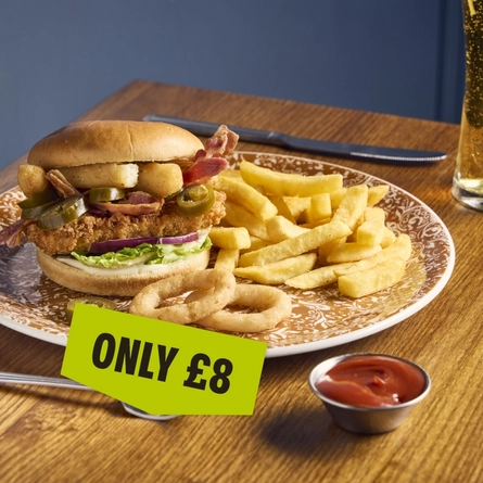 A banner showing a plated Build Your Own Burger dish with chips and onion rings sat on a table with the wording "Only £8" to advertise dishes at Cornerstone venues.