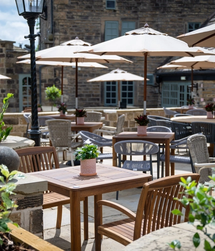 The exterior beer garden seating area of The Old Mill in Brighouse.