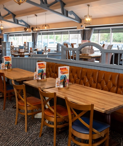 The interior restaurant seating area with TV, at The Stanley Ferry.