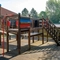 Exterior beer garden of a pub with a seating and play area.