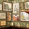 A close up view of framed artwork on a floral wallpapered wall inside the King's Head.