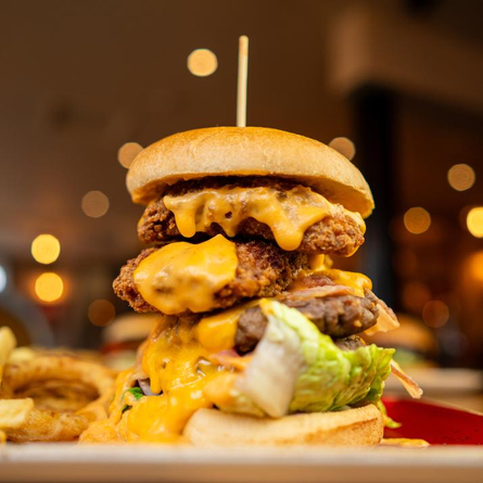 a closeup of a cheesy burger