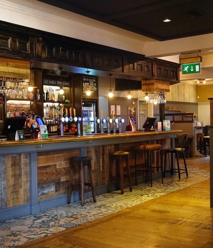 Interior bar and dining area of a pub.
